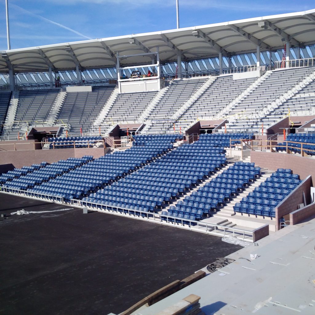 USTA Grandstand Stadium SPS tiered decking SPS tiered seating decking installation at USTA National Tennis Center's Grandstand Stadium