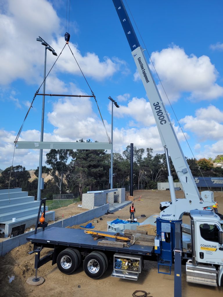 SPS terrace lift at USD Softball complex Small crane lifting SPS terrace at USD softball complex